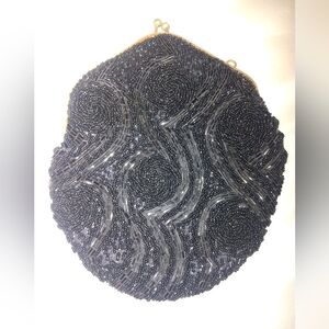 Antique hand beaded black and gold clutch